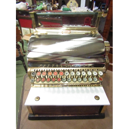 4007 - An NCR National Cash Register, model 748-SH, serial no. AV663158, highly polished case of brass and ... 