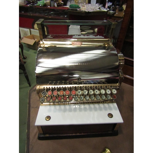 4007 - An NCR National Cash Register, model 748-SH, serial no. AV663158, highly polished case of brass and ... 
