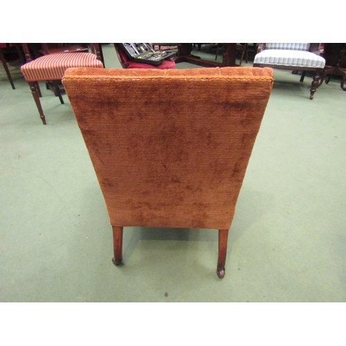 4013 - A circa 1900 walnut armchair the button backrest over turned and square tapering legs with reeded de... 