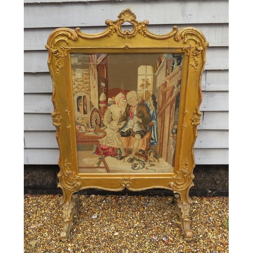 4165 - A Georgian gilt and gesso framed fire screen with later tapestry panel of couple to centre. Silk lin... 