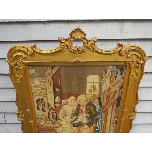 4165 - A Georgian gilt and gesso framed fire screen with later tapestry panel of couple to centre. Silk lin... 