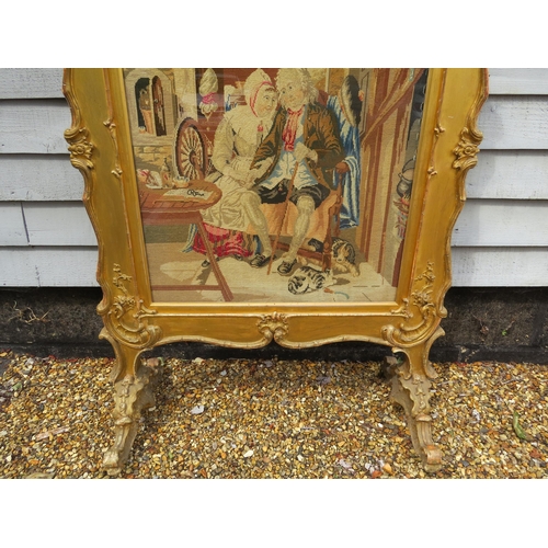 4165 - A Georgian gilt and gesso framed fire screen with later tapestry panel of couple to centre. Silk lin... 