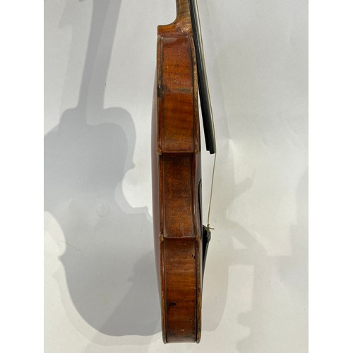 7067 - A late 19th / early 20th Century Guarneri copy violin, full size (4/4), two piece figured maple back... 