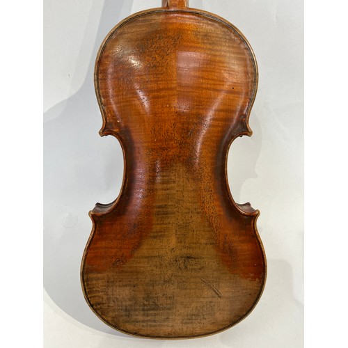 7067 - A late 19th / early 20th Century Guarneri copy violin, full size (4/4), two piece figured maple back... 