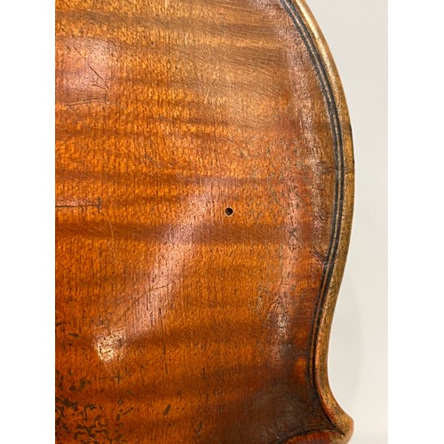 7067 - A late 19th / early 20th Century Guarneri copy violin, full size (4/4), two piece figured maple back... 