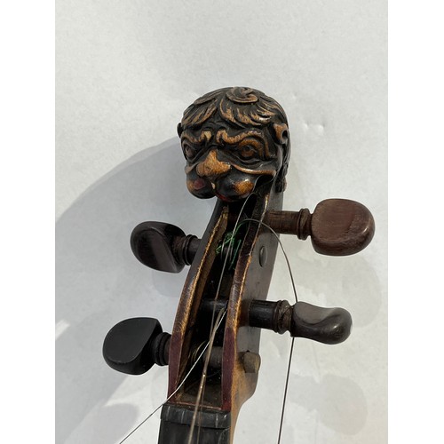 7068 - A late 19th / early 20th Century violin, the scroll as a lion, for renovation, with rosewood veneere... 