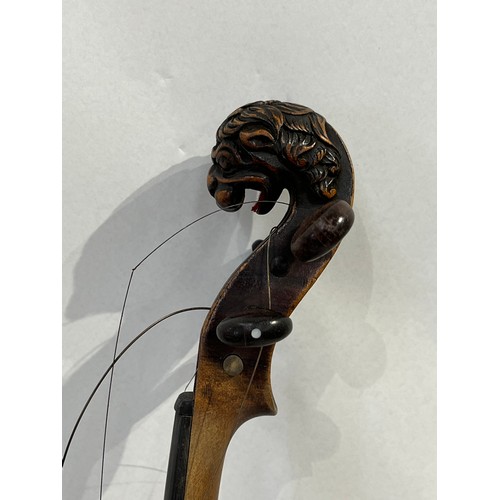 7068 - A late 19th / early 20th Century violin, the scroll as a lion, for renovation, with rosewood veneere... 