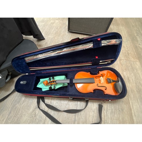 7071 - A Stentor Student full size (4/4) violin, cased with two bows, cased