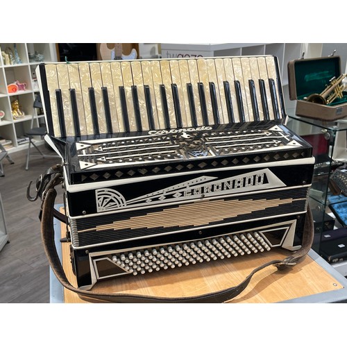 7103 - A vintage 'Coronado' 120 bass accordion, black with jeweled detail and pealescent keys, with sheet m... 