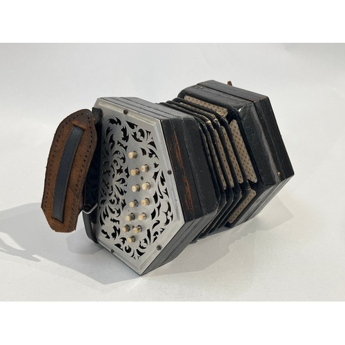 7130 - An early-mid 20th Century concertina, pierced metal ends