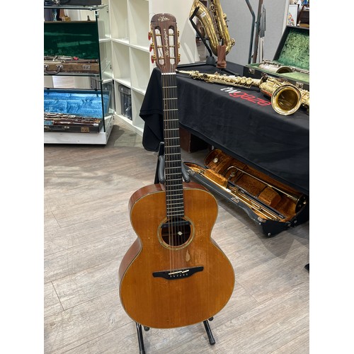 7073 - An Aria 'Sandpiper' acoustic guitar, added pickup, some wear, with hard case