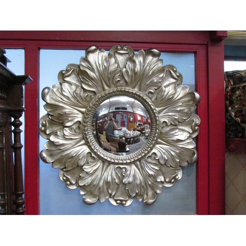 4012 - A classical style acanthus leaf form convex wall mirror, metallic finish, 85cm diameter total
