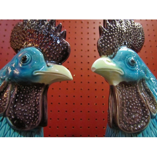 4059 - A pair of Oriental turquoise cockerels, beaks chipped, 42cm tall