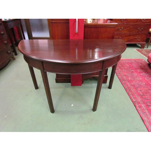 4061 - A pair of George III mahogany D-end tables on chamfered square leg supports, 73cm tall x 120cm wide ... 