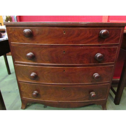 4072 - An early to mid 19th Century mahogany bow front chest of four graduating long drawers with bun handl... 