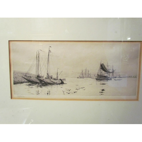 4077 - A William Wyllie (1851-1931) pencil signed etching of boats, framed and glazed, 12cm x 30cm image si... 