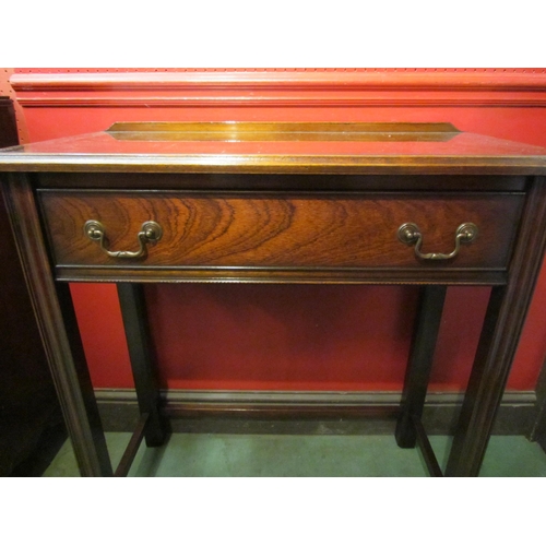 4079 - A Georgian style mahogany hall table, the single frieze drawer over reeded square legs joined by str... 