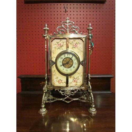 4086 - A mantel clock, ornate brass frame and ceramic tile with floral decoration holding platform timepiec... 