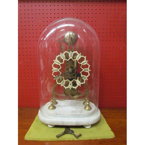 4115 - A skeleton clock on marble plinth under glass dome, with key and pendulum, 44cm tall x 27cm wide x 1... 