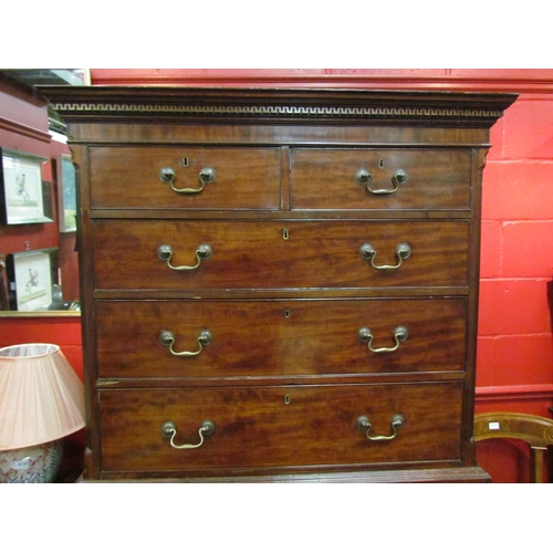 4125 - A George III mahogany gentleman's chest on chest with brushing slide, Greek key dentil cornice, cham... 