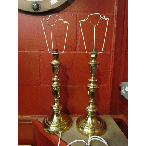 4132 - A pair of Lampart brass table lamps,. 44cm high not including shade holders