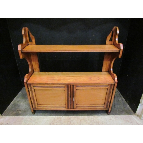 4146 - A Victorian satin walnut wall shelf with two door cupboard and key, 61cm tall x 58cm wide x 15cm dee... 