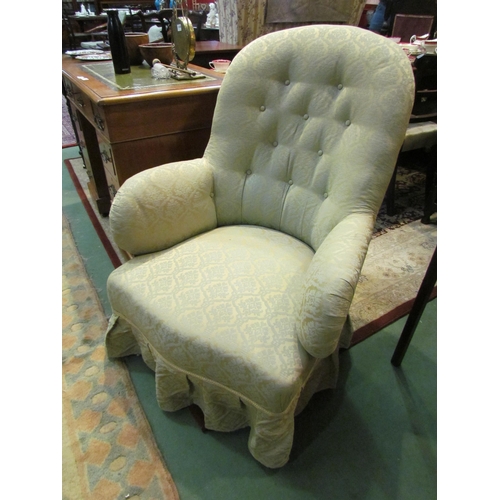 4186 - A circa 1860 button-back armchair, the scroll arms over a bow front seat on turned and tapering waln... 