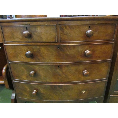 4210 - A Victorian flame mahogany bow-fronted chest of two short over three long drawers, bracket feet, bun... 