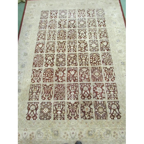 4395 - A maroon and cream floral rug,  330cm x 240cm            (R)       £60