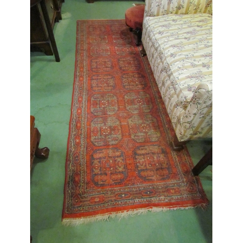 4111 - A late 19th / early 20th Century Turkman geometric design runner rug, red ground with multiple borde... 