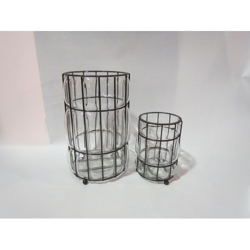 4160 - A large cushioned glass and wire framed vase/candle holder, 26.5cm tall, and a smaller matching exam... 