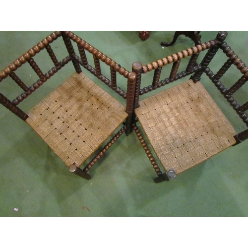 4213 - Two mahogany bobbin turned corner chairs with rush seats