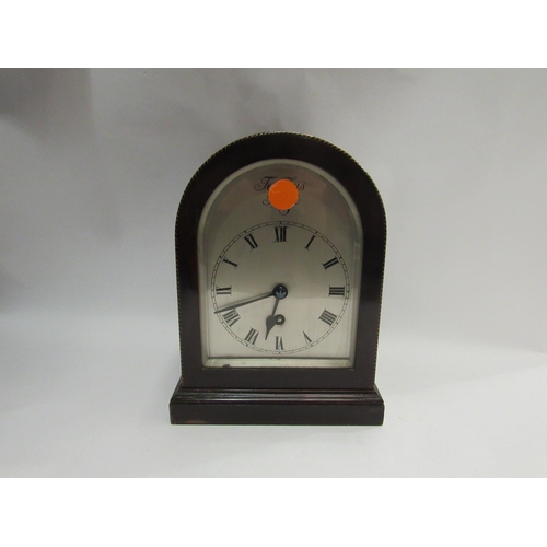 4362 - A Tempus Fugit mantel clock and an embossed brass charger, 45cm diameter