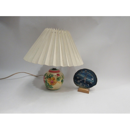 4384 - A table lamp with painted flower design ceramic base, together with a quartz stone mantel clock     ... 