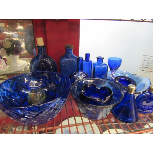 4386 - A quantity of blue glassware including bowls, bottles, etc