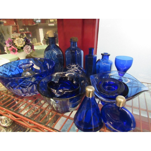 4386 - A quantity of blue glassware including bowls, bottles, etc