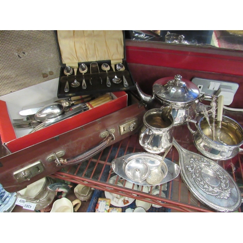 4388 - A quantity of plated ware tea wares, a silver back mirror marked Birmingham and a silver chamber sti... 