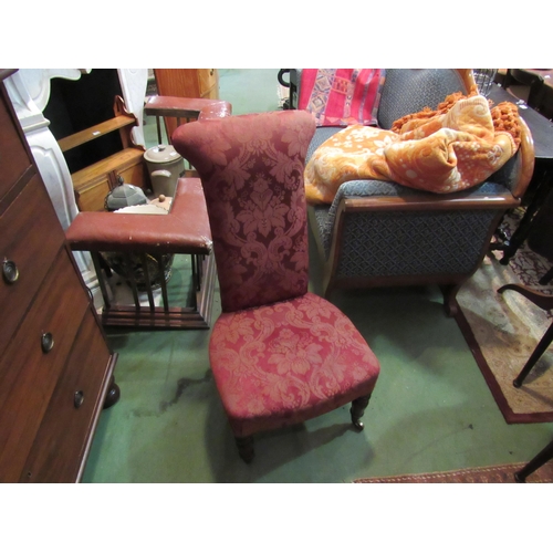 4167 - A circa 1850 mahogany prie-dieu chair with pink patterned upholstery over turned and tapering legs o... 