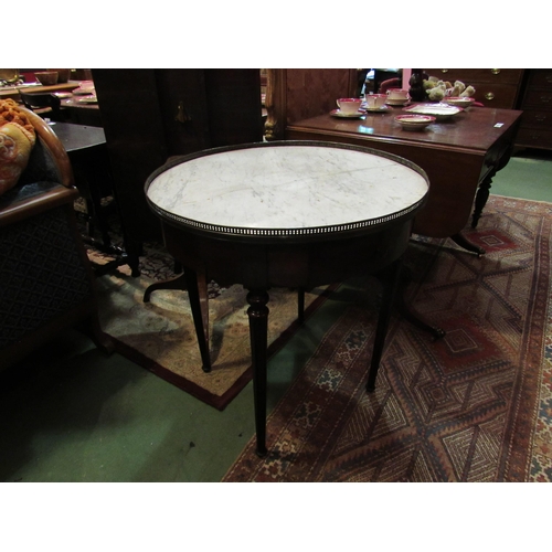 4169 - A 19th Century French variegated marble circular top lamp table with brass gallery over two drawers ... 