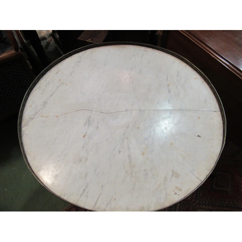 4169 - A 19th Century French variegated marble circular top lamp table with brass gallery over two drawers ... 