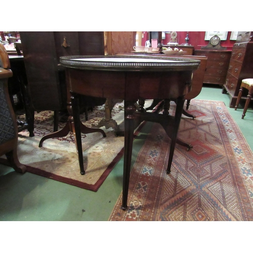 4169 - A 19th Century French variegated marble circular top lamp table with brass gallery over two drawers ... 