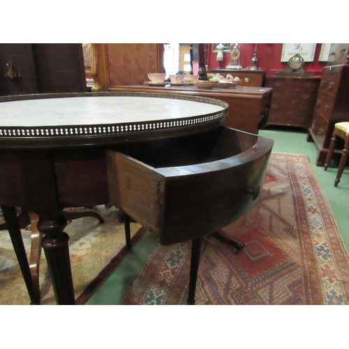 4169 - A 19th Century French variegated marble circular top lamp table with brass gallery over two drawers ... 