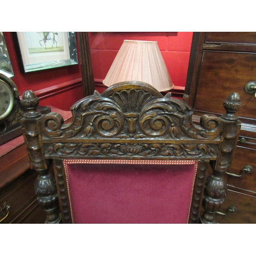 4172 - A Victorian carved oak throne style chair, scrolled foliate frame, velour upholstery, on fluted and ... 