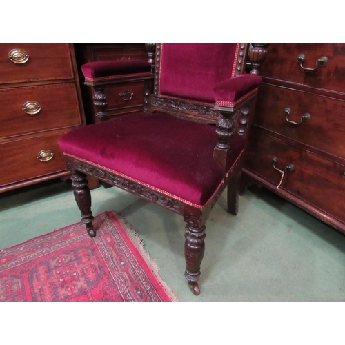 4172 - A Victorian carved oak throne style chair, scrolled foliate frame, velour upholstery, on fluted and ... 