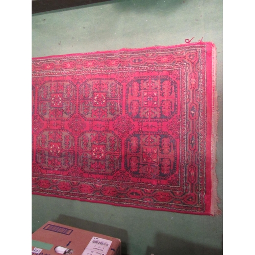 4190 - A late 19th / early 20th Century Turkman runner rug, red ground with multiple borders, 266cm long x ... 