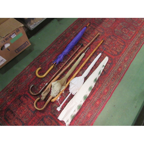 4219 - A selection of walking sticks, umbrellas and a parasol (6)       (E)    £15-20