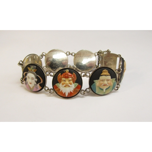 8297 - A Toshikane Japan silver seven panel bracelet, each circular panel depicting a sage, 18cm long