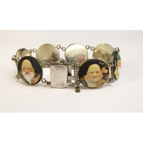 8297 - A Toshikane Japan silver seven panel bracelet, each circular panel depicting a sage, 18cm long