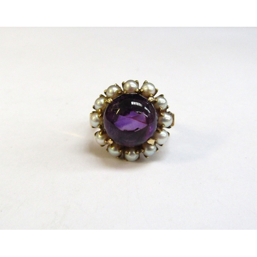 8294 - A gold amethyst and pearl ring, the central cabochon amethyst framed by pearls, 17mm diameter stampe... 