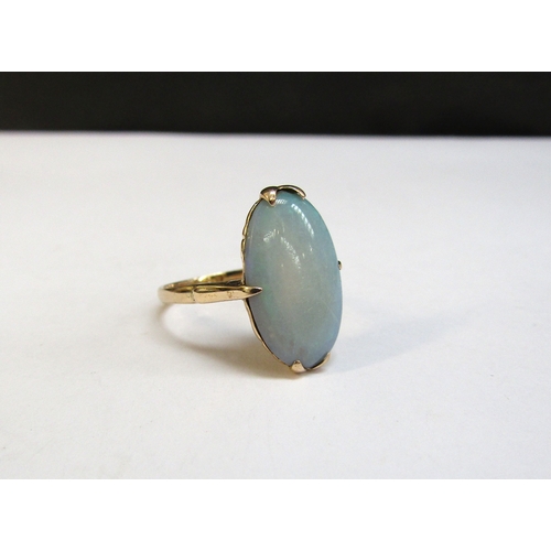 8293 - A gold ring with elongated oval opal, 19mm x 12mm, unmarked. Size P/Q, 3.4g     (R) £100